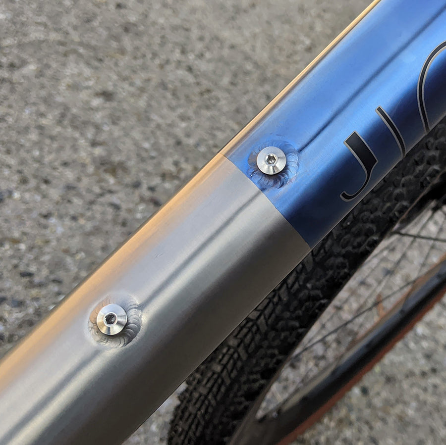 Low profile water bottle cage outlet